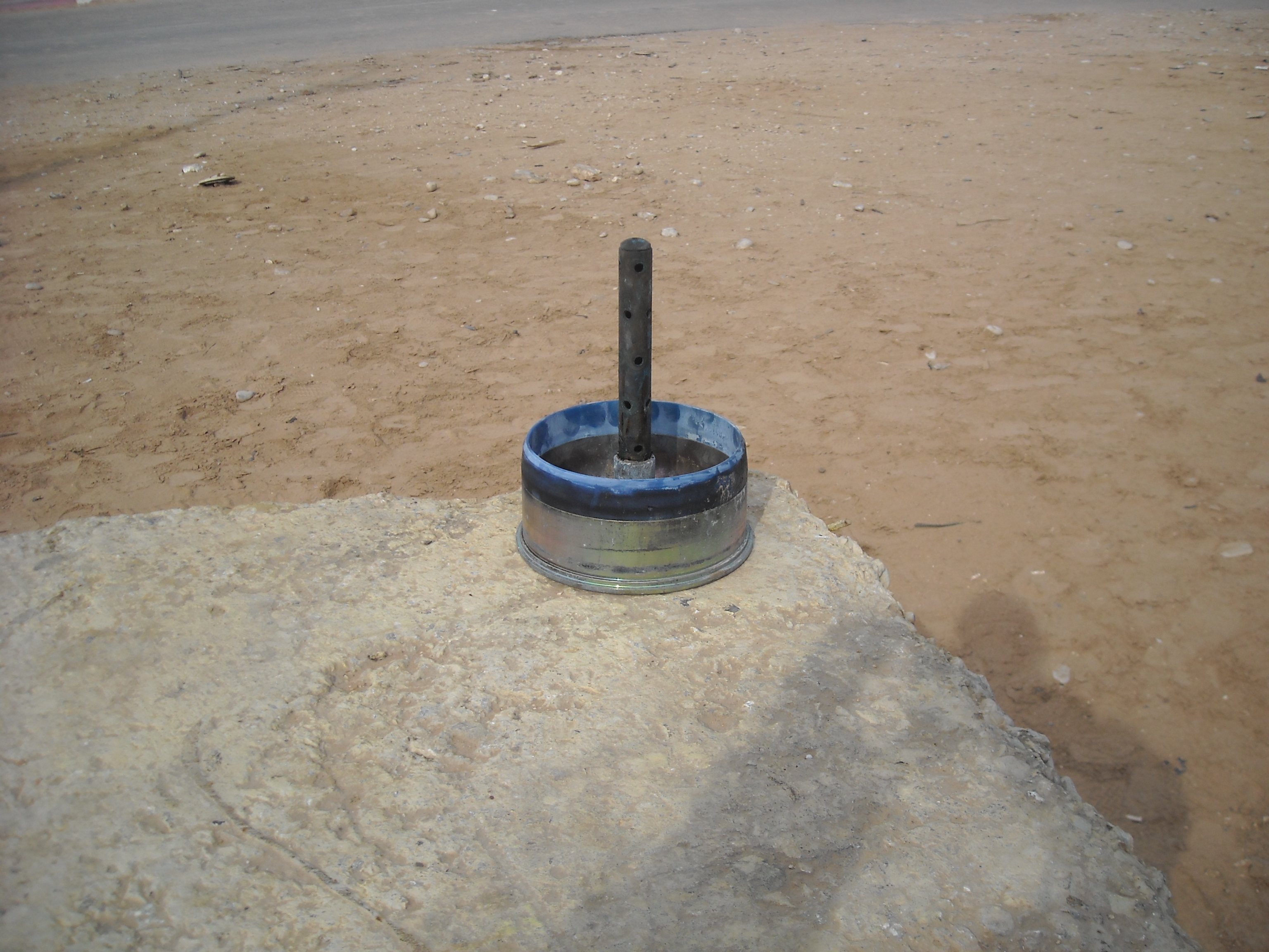 120mm smoothbore tank ammunition cartridge showing the complete round assembly with sabot petals and fin-stabilised penetrator