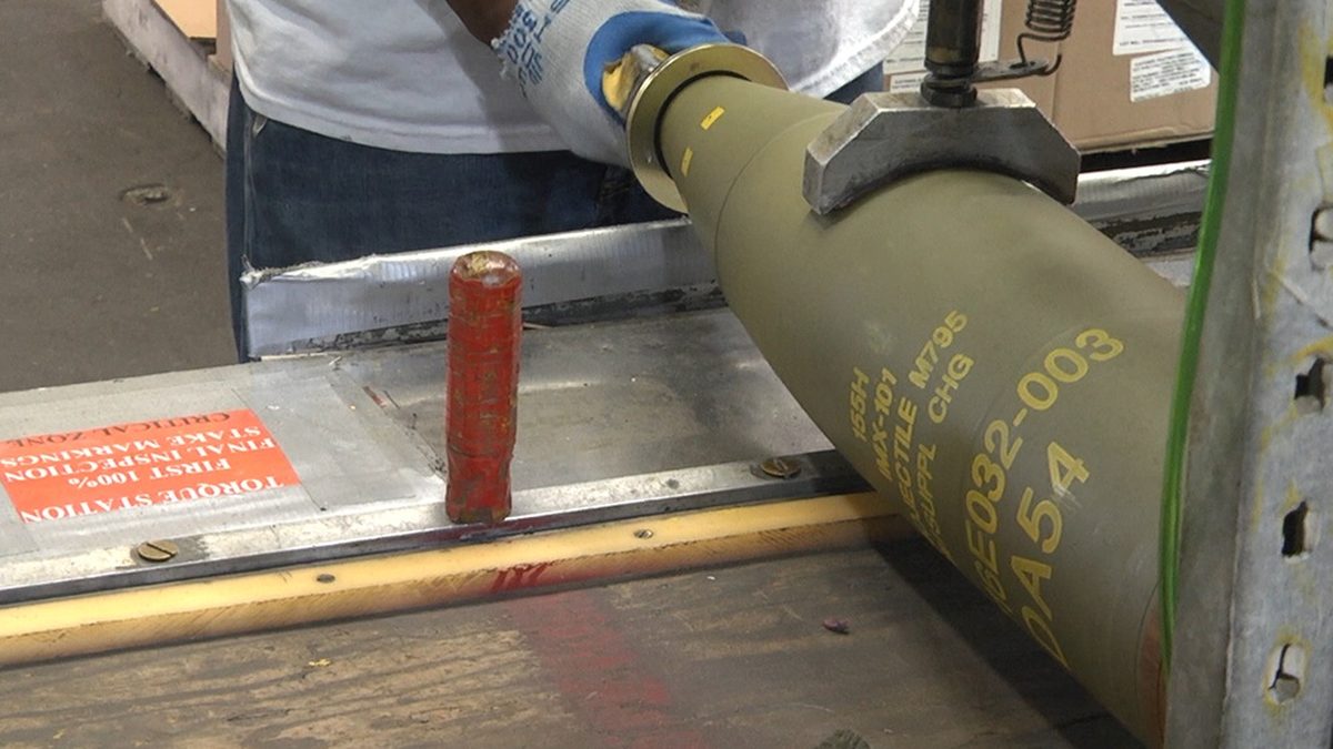 155mm projectile production line at Iowa Army Ammunition Plant showing artillery shell manufacturing