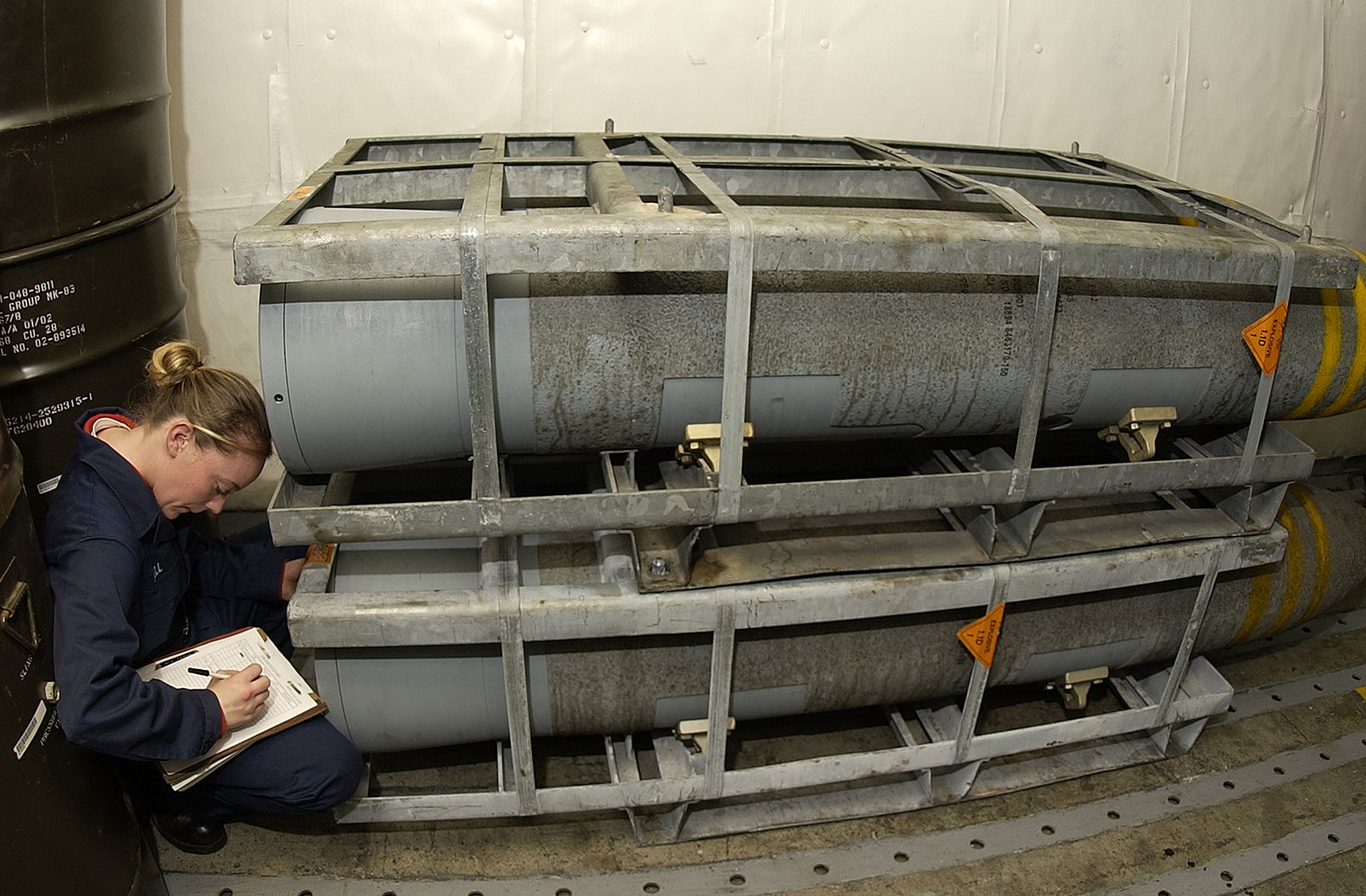 Pallet of BLU-109 2,000-pound hardened penetrator bomb bodies being inventoried aboard a US Navy aircraft carrier