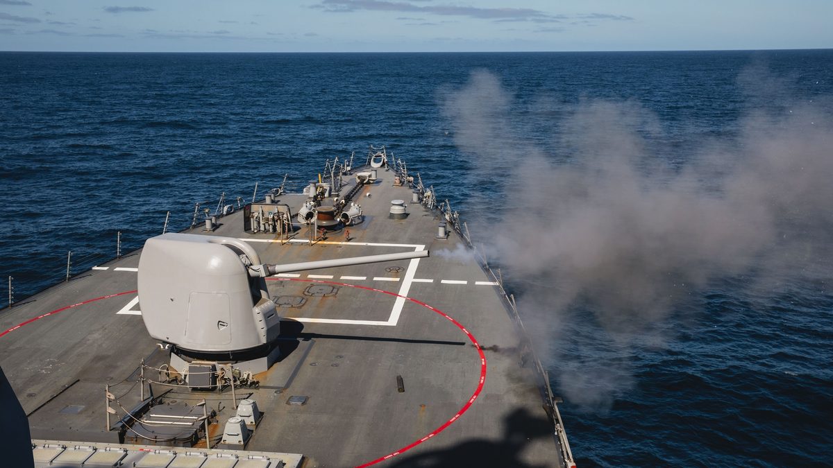 Mark 45 5-inch gun muzzle blast as USS John S. McCain fires during live-fire exercise in the Pacific Ocean