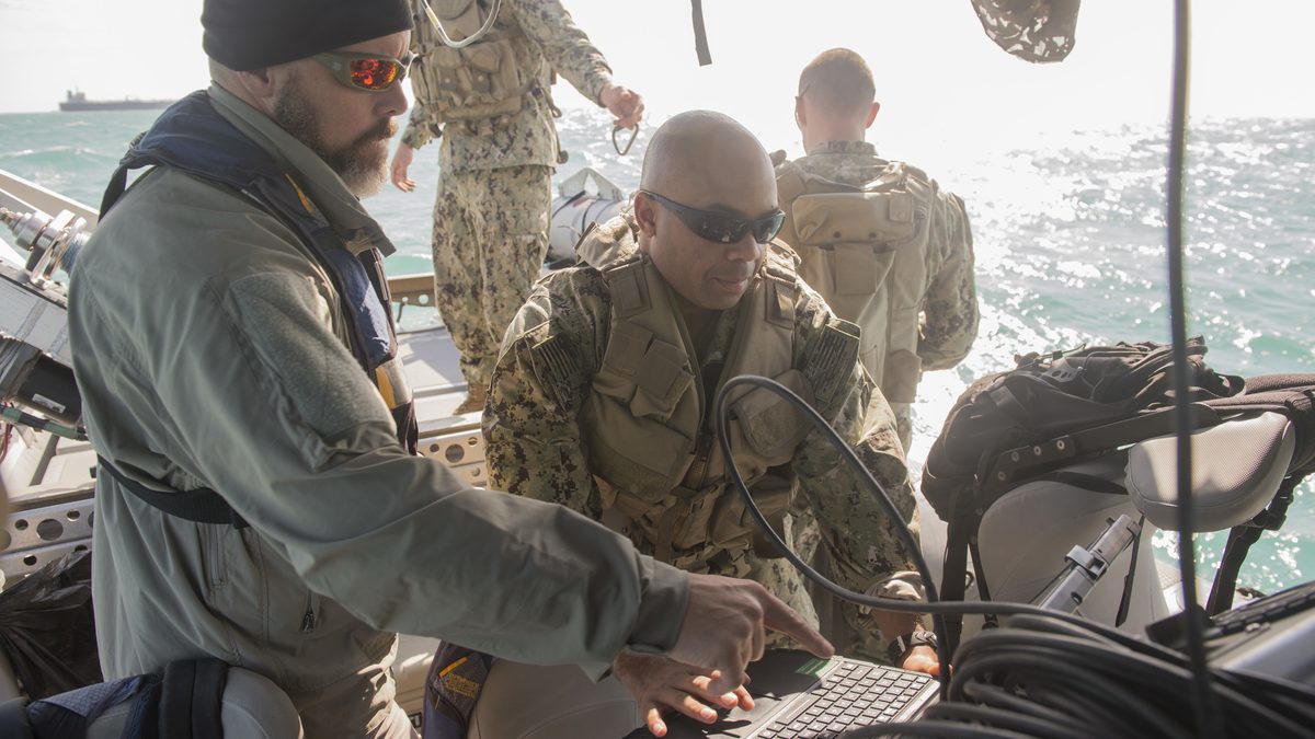 CTG-56.1 operators send orders to a Mark 18 Mod 2 Kingfish UUV from a rigid-hull inflatable boat in the Persian Gulf
