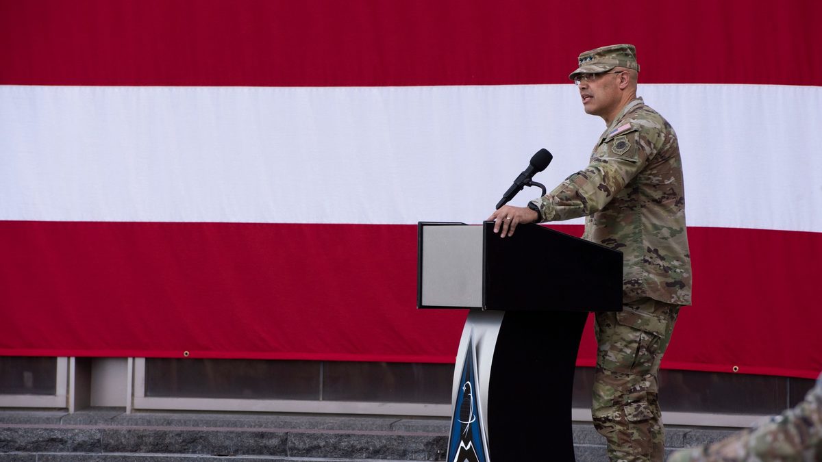 U.S. Space Force Lt. Gen. David N. Miller, Jr., Space Operations Command Commander, speaks at a podium at the Space Delta 8 Change of Command ceremony.