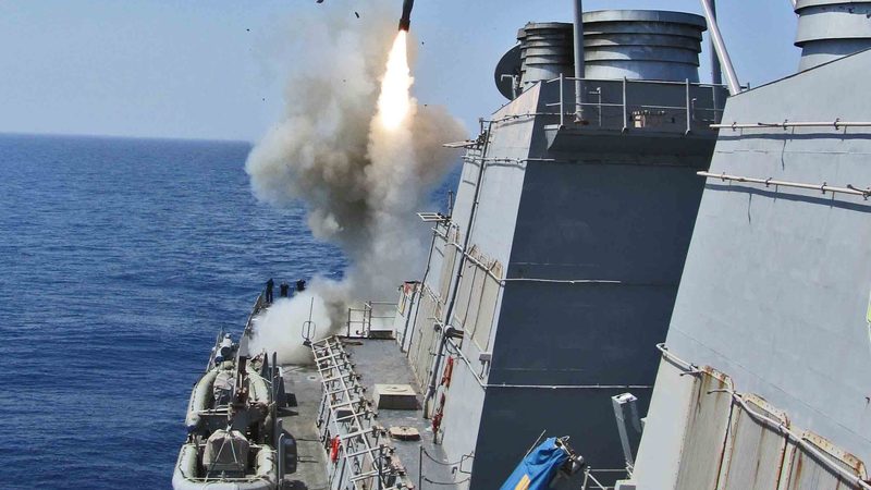 The guided-missile destroyer USS Barry (DDG 52) launches a Tomahawk cruise missile during Operation Odyssey Dawn.