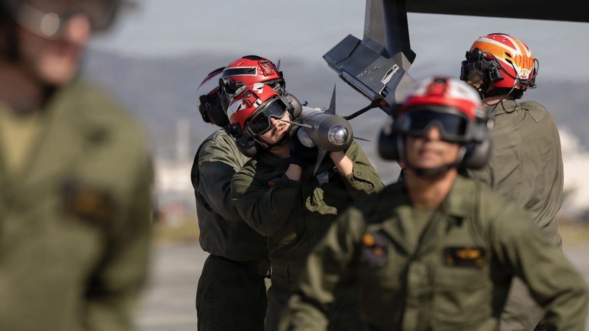 U.S. Marines load an AIM-9X Sidewinder missile onto an F-35B Lightning II at MCAS Iwakuni, Japan