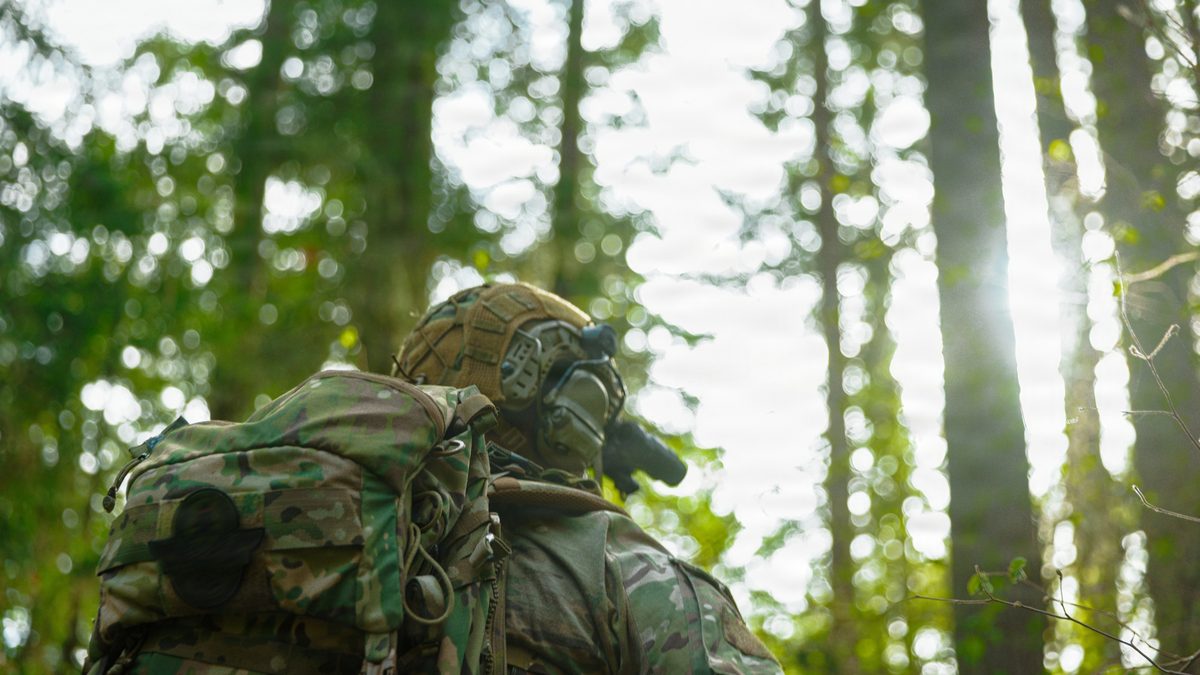 A Special Forces Group operator engages targets during a maneuver live-fire exercise