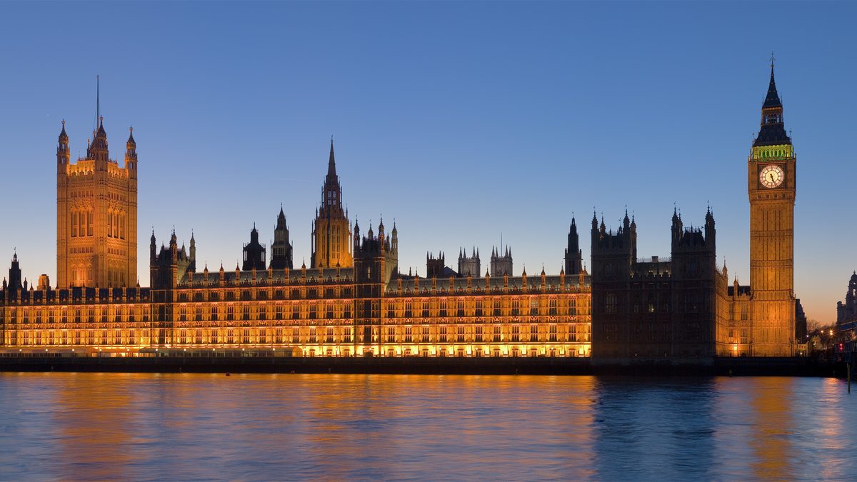 Palace of Westminster at dusk, the institutional locus of UK parliamentary procurement scrutiny
