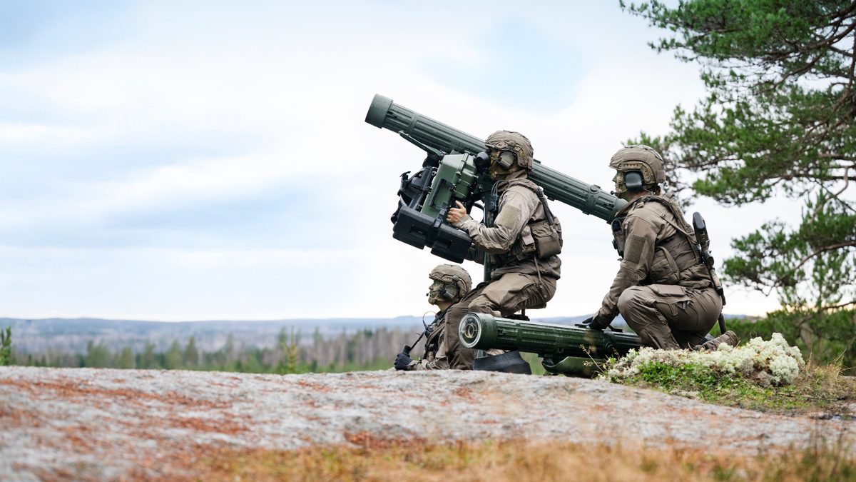 RBS 70 NG crew in man-portable configuration on rocky terrain, Swedish landscape