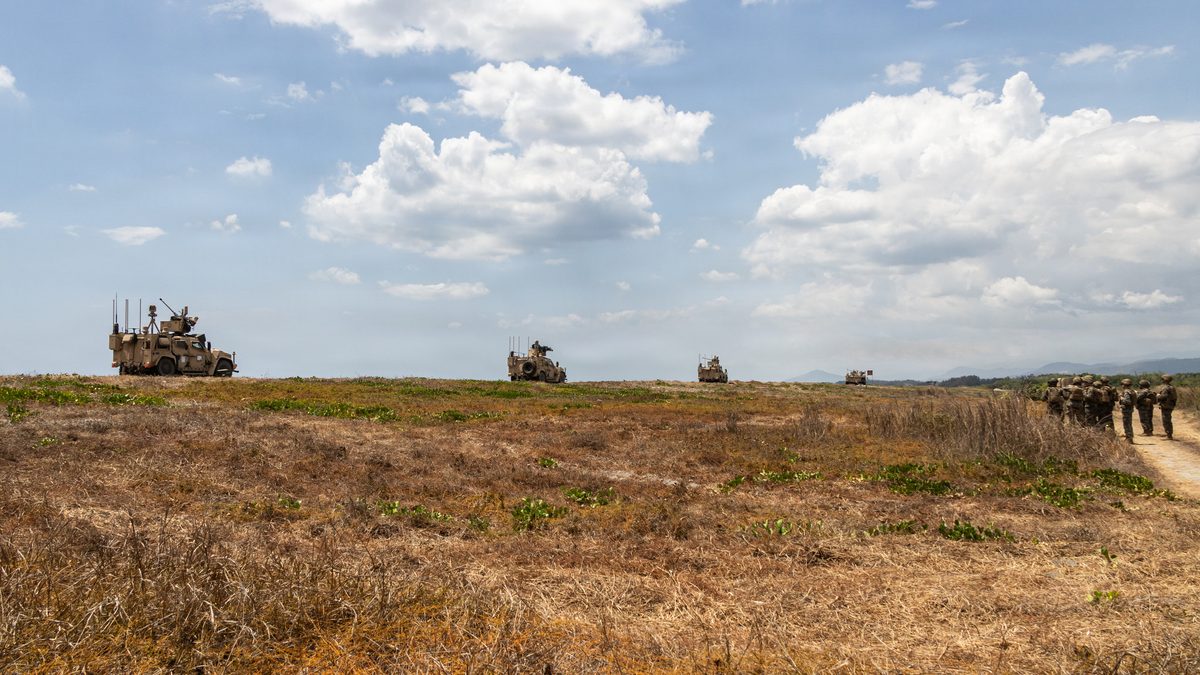 U.S. Marine Corps MADIS Mk1 firing during Exercise Balikatan 2026 in the Philippines. The XM914E1 30mm chain gun sits in the Kongsberg Protector RS6 remote weapon station, alongside the four-round Stinger ATAL pod and EO/IR sensor.