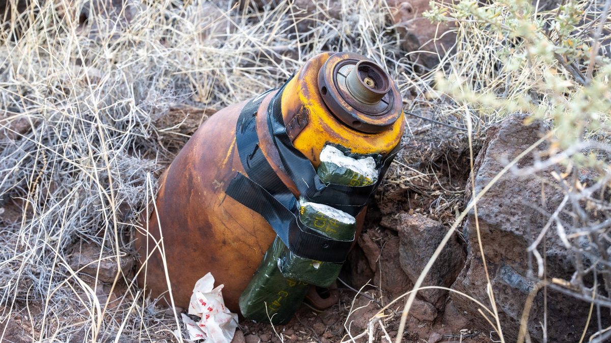 A WWII-era unexploded ordnance item rests in place before disposal at the Pueblo of Acoma, New Mexico.