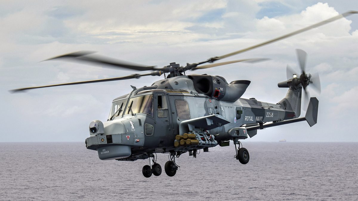 Royal Navy AW159 Wildcat helicopter armed with Thales Martlet missiles in flight over the sea