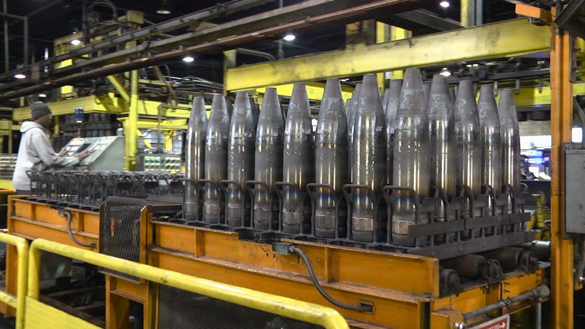 155mm artillery projectile bodies on a production line