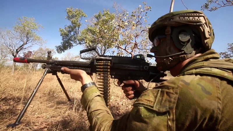 Australian soldier fires a belt-fed FN Minimi 7.62 light machine gun during Exercise Talisman Saber 2017