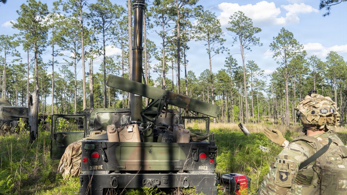 A US Army soldier observes a VAMPIRE counter-UAS rocket launcher