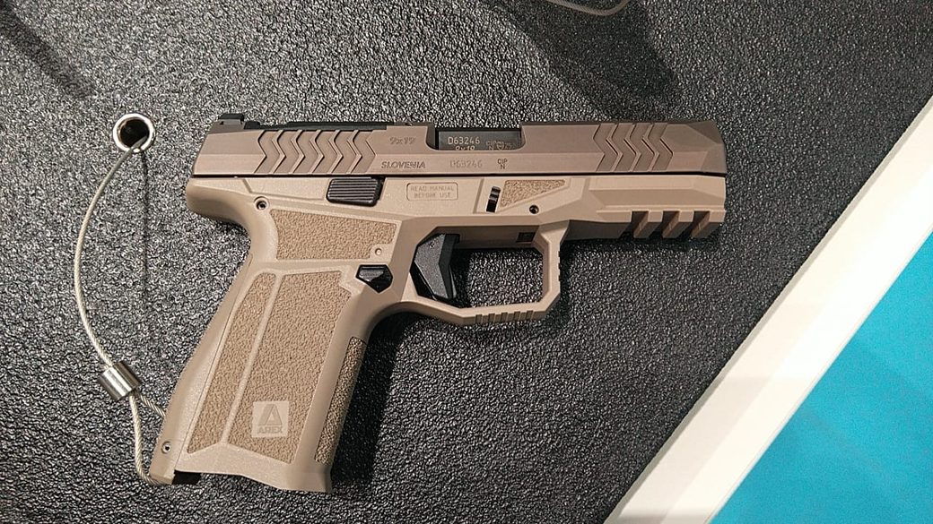 Left-side profile of the full-size 9 mm pistol showing optics-ready slide cut and polymer frame