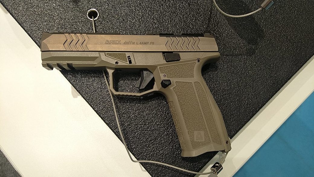 Pistol slide roll-marked AREX with delta logo, model designation and 9x19 chambering