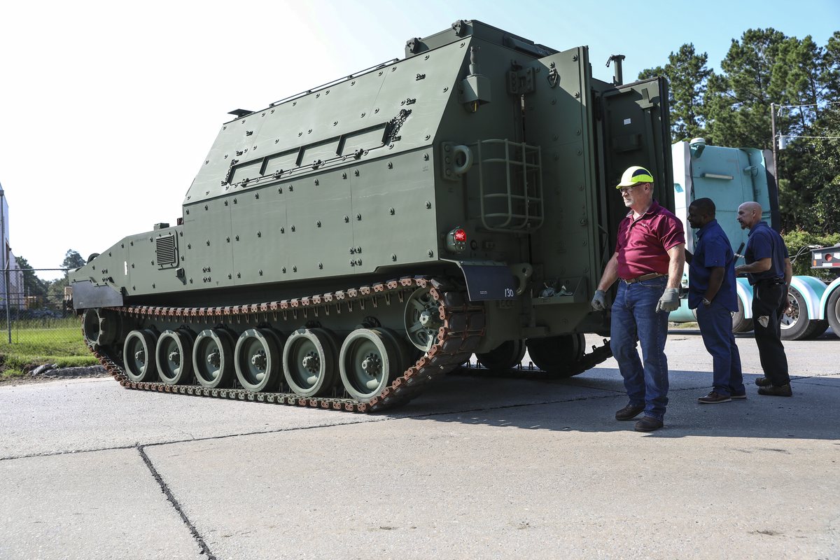 Department of Defense civilians inspect an M992A3 Carrier Ammunition Tracked vehicle at Fort Stewart, Georgia