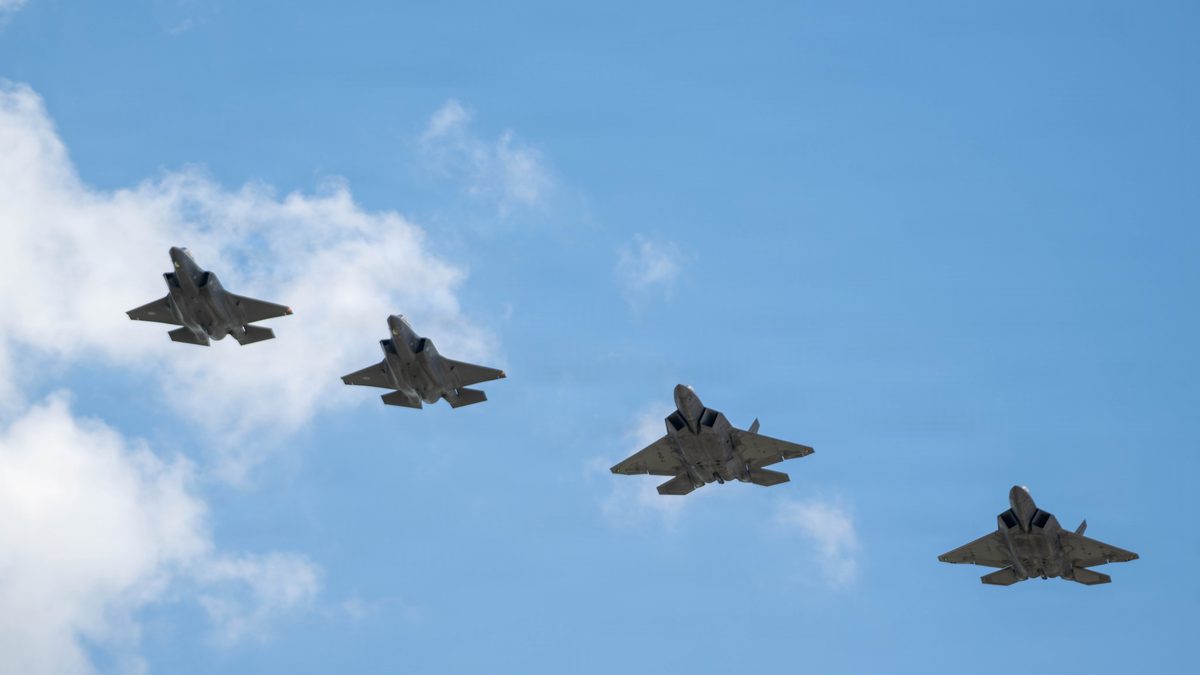 Finnish Air Force F-35 Lightning II jets in formation with US Air Force F-22 Raptors