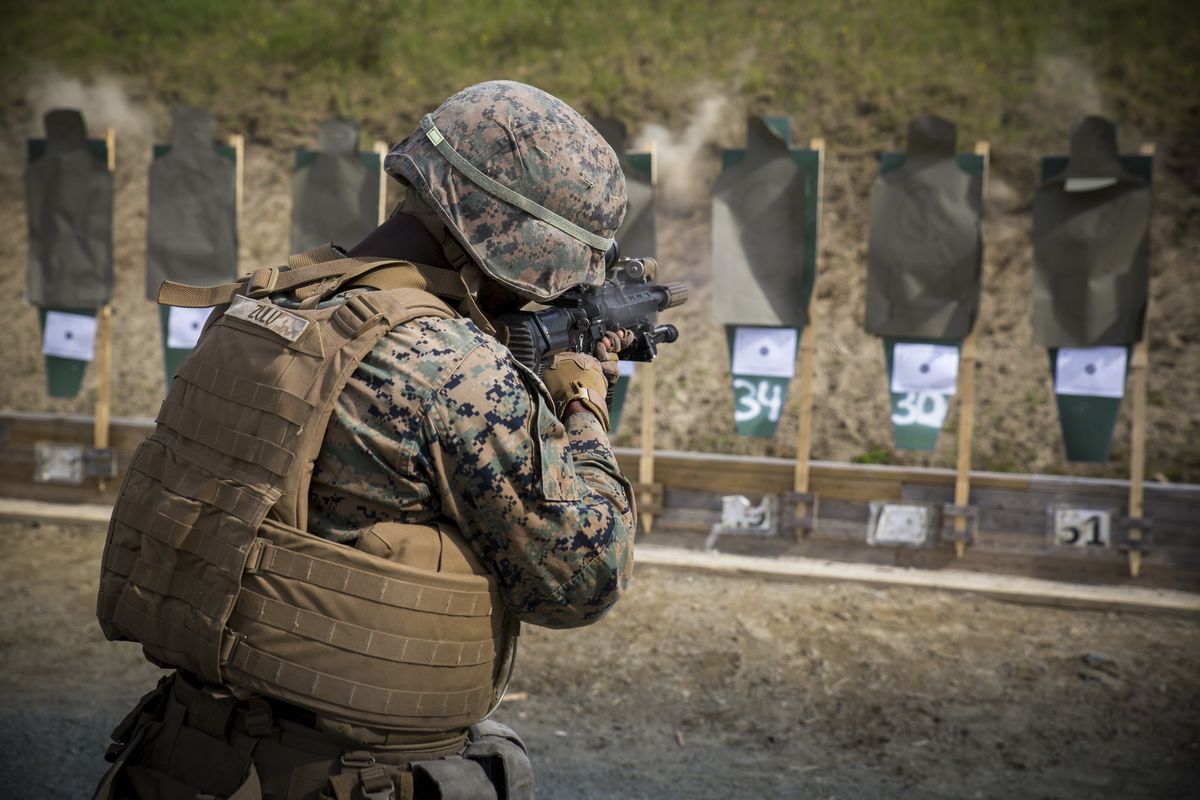 A Marine fires a suppressed M27 with Squad Day Optic during a combat marksmanship range in Norway in June 2017