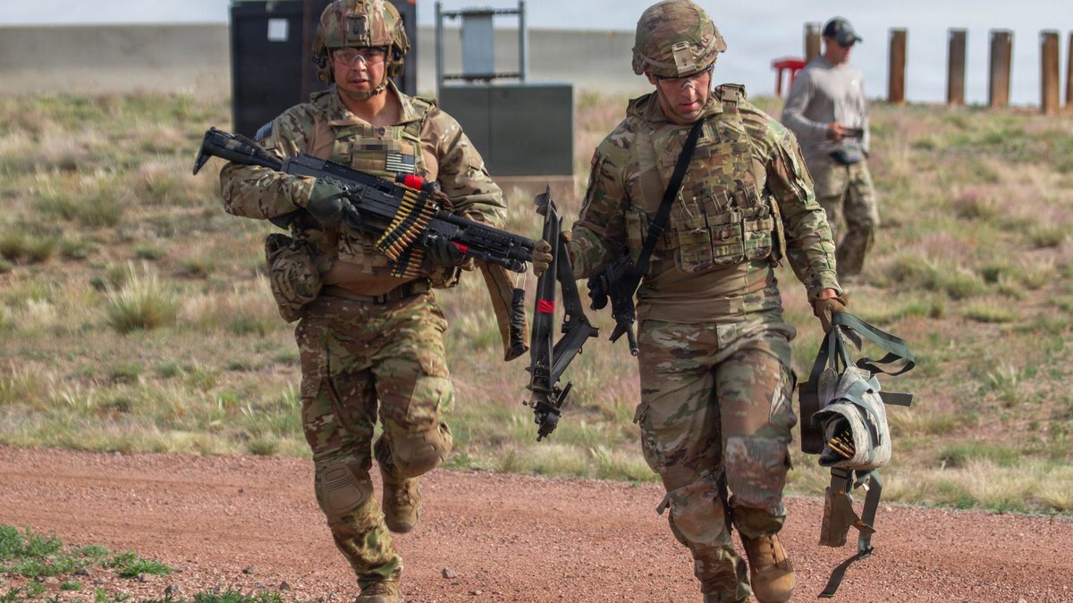 Soldier firing an M240, the US designation of the FN MAG GPMG, on a live-fire range