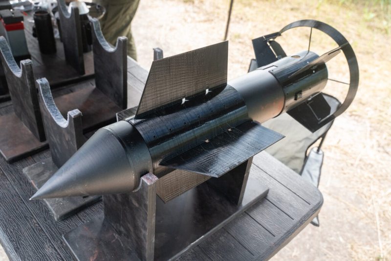 A Firefly guided munition fitted with 3D-printed steering fins on a stand during Ukrainian testing