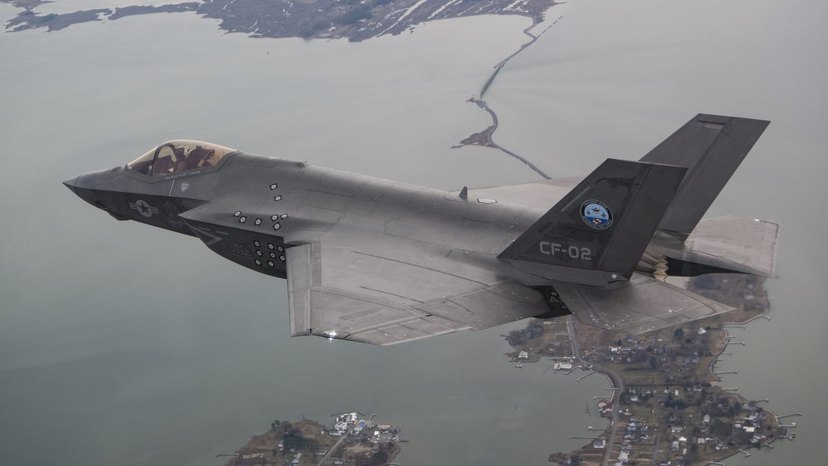 An F-35C Lightning II carrying an inert GBU-53/B StormBreaker during airborne testing.