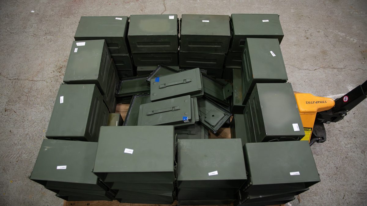 Small arms ammunition cartridges stored on a pallet during an ammunition roll test.