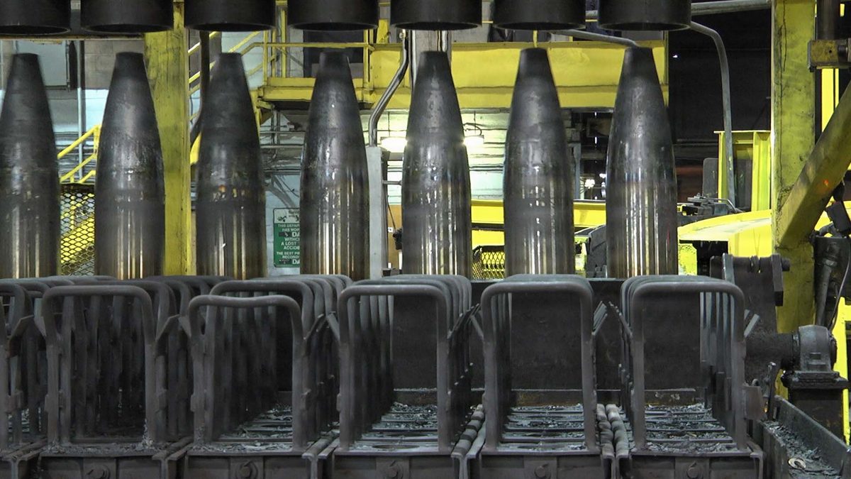 Rows of unfilled 155mm projectile bodies on the heat-treat line at Scranton Army Ammunition Plant