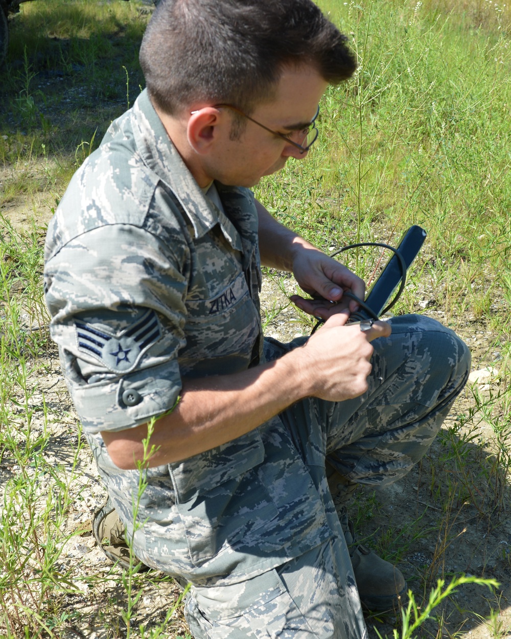 EOD specialist preparing explosive charge for munition disposal operations