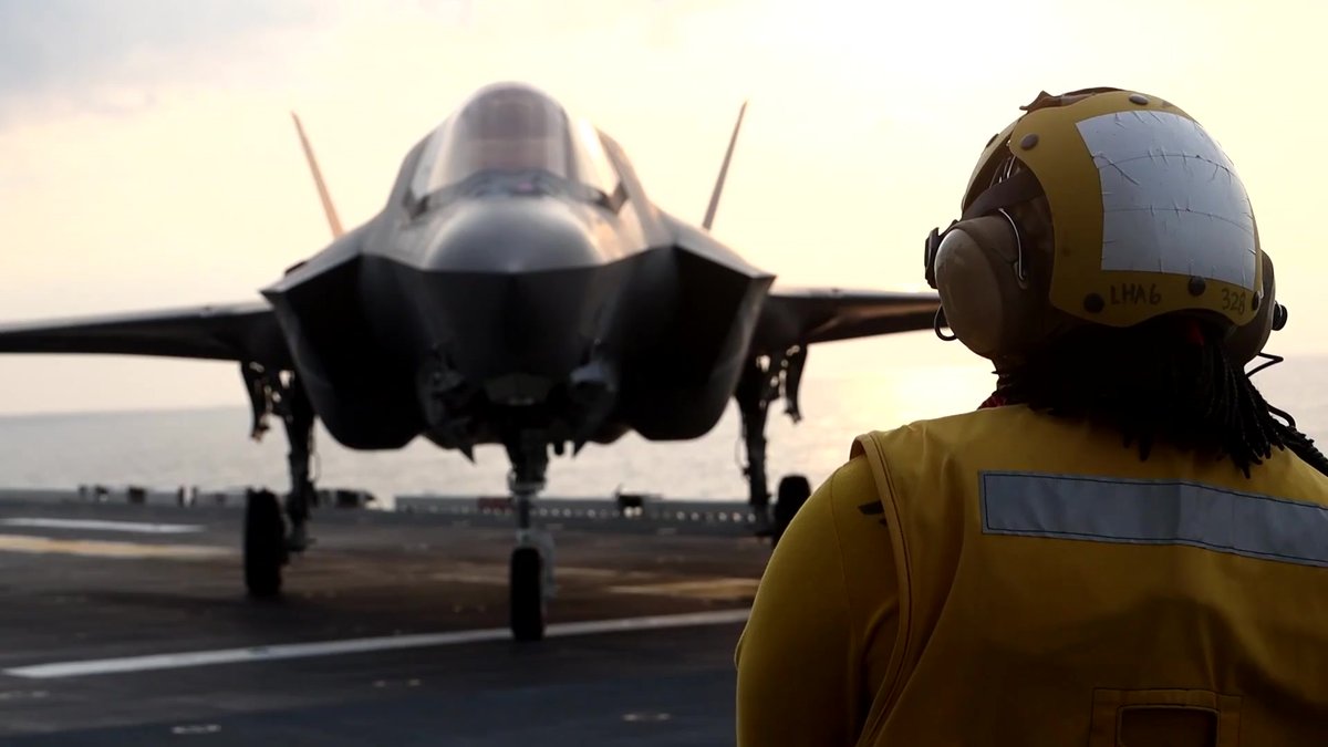 F-35B Lightning II launch operations on the flight deck of the USS America Amphibious Ready Group at dusk