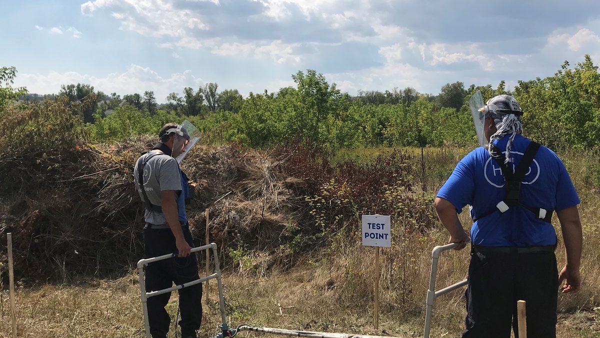 Ukrainian deminers clearing unexploded ordnance in the Donetsk region using metal detectors and prodders